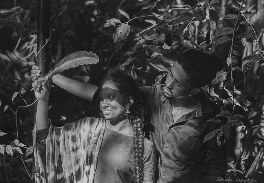 A Millisecond – 0.001s by Lakshika Rajapaksha, charcoal and white pastel drawing of a couple meeting in the jungle